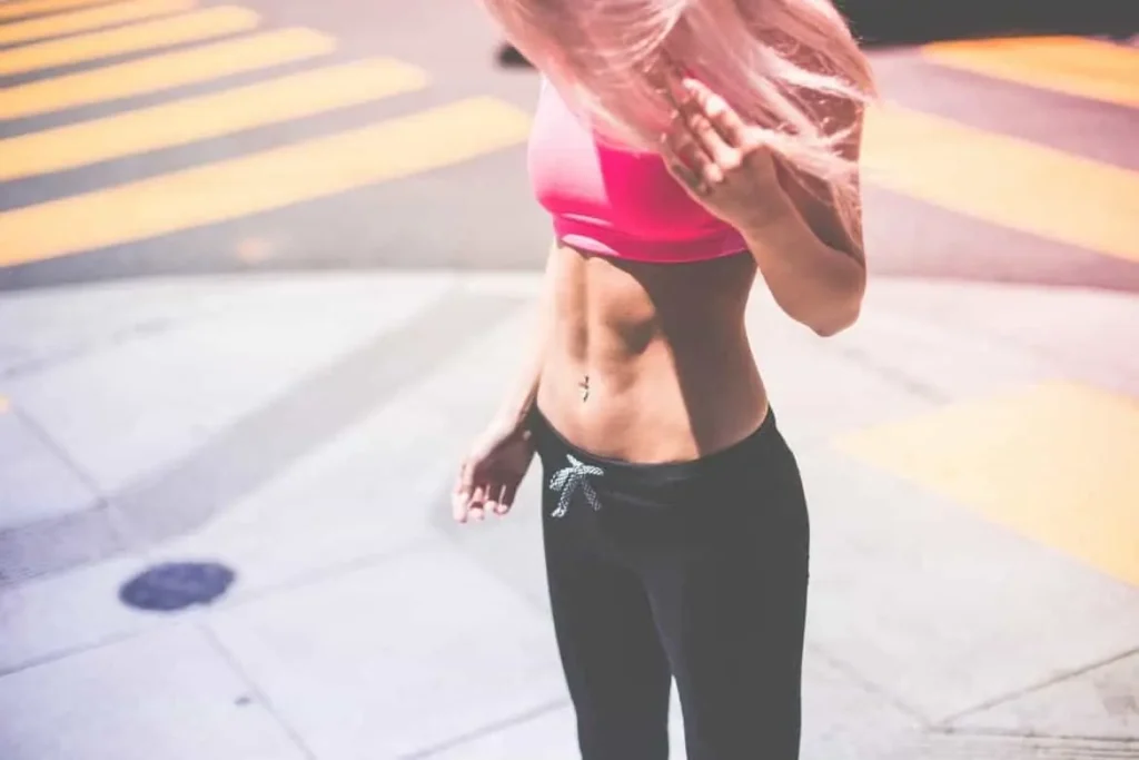 Woman with toned stomach after LA-EMS Body Sculpting Treatment Banstead 