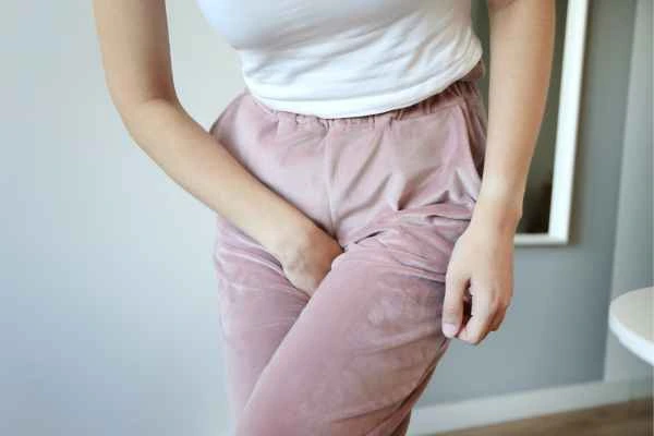 woman running for the toilet because of urinary incontinence Banstead